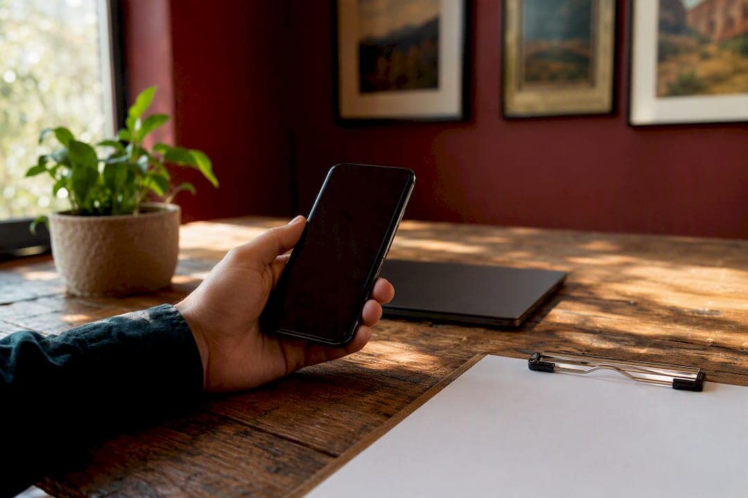Hand holding smartphone with call tracking