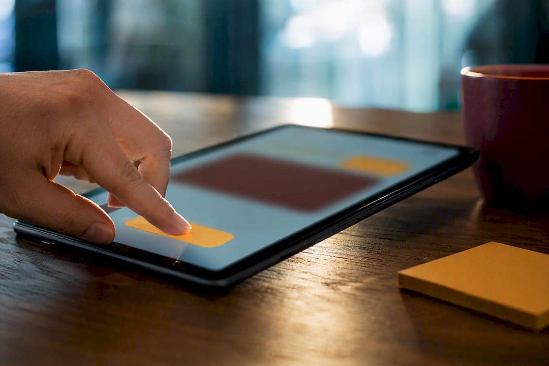 Hand testing a landing page CTA button
