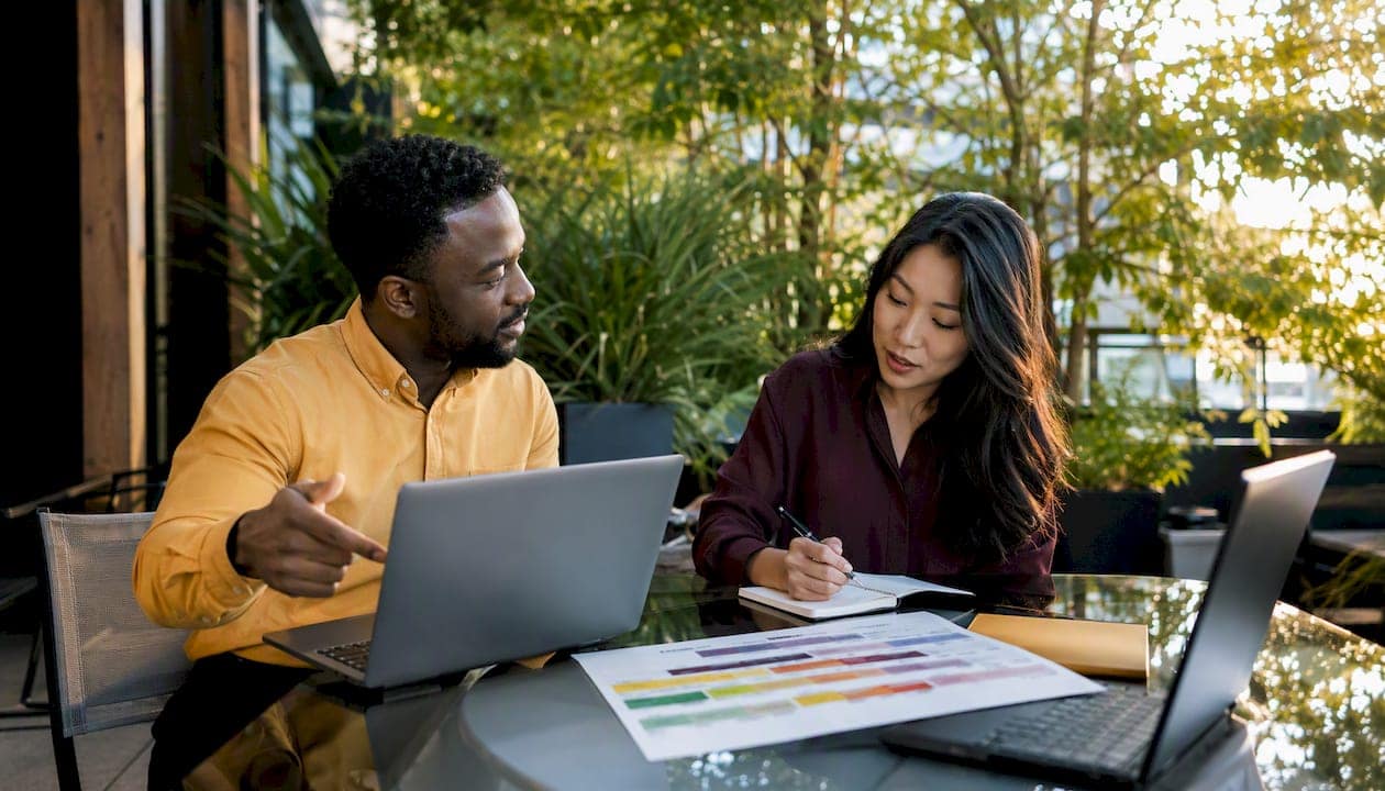 Two professionals discussing redesign project details