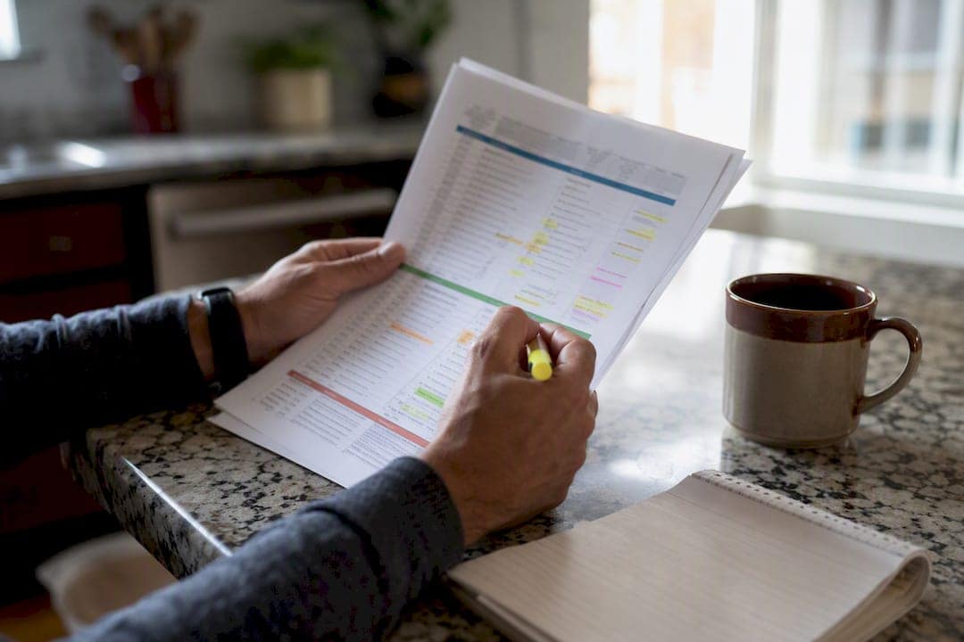 Hands reviewing internal link audit report