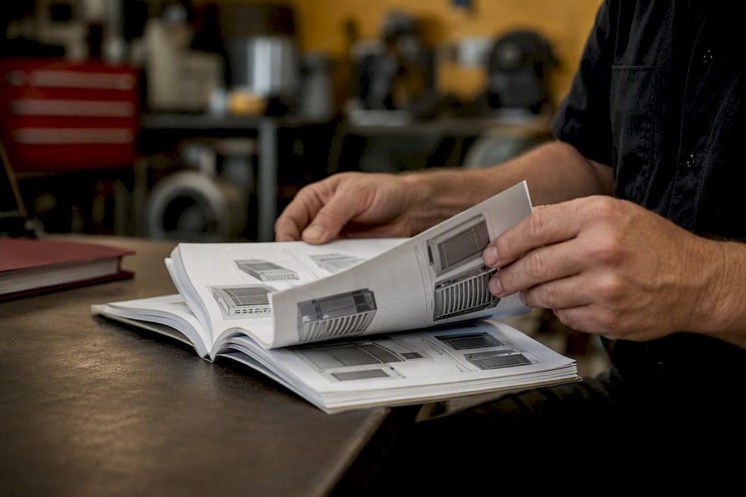 Technician holding tablet near server rack