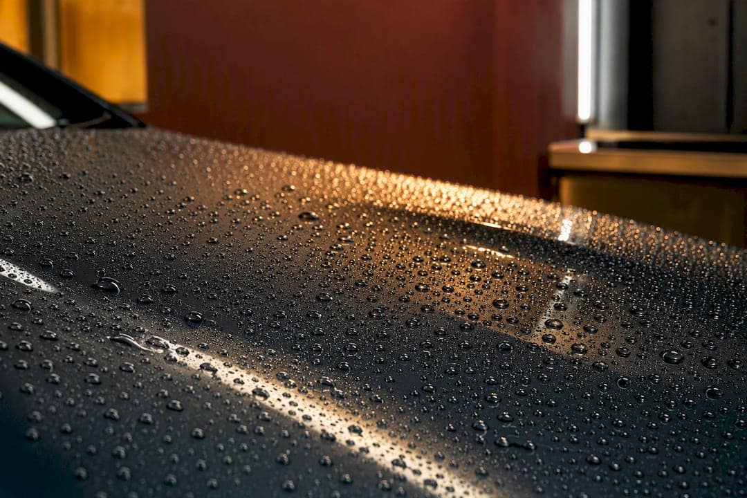 Water beads on a ceramic-coated vehicle panel